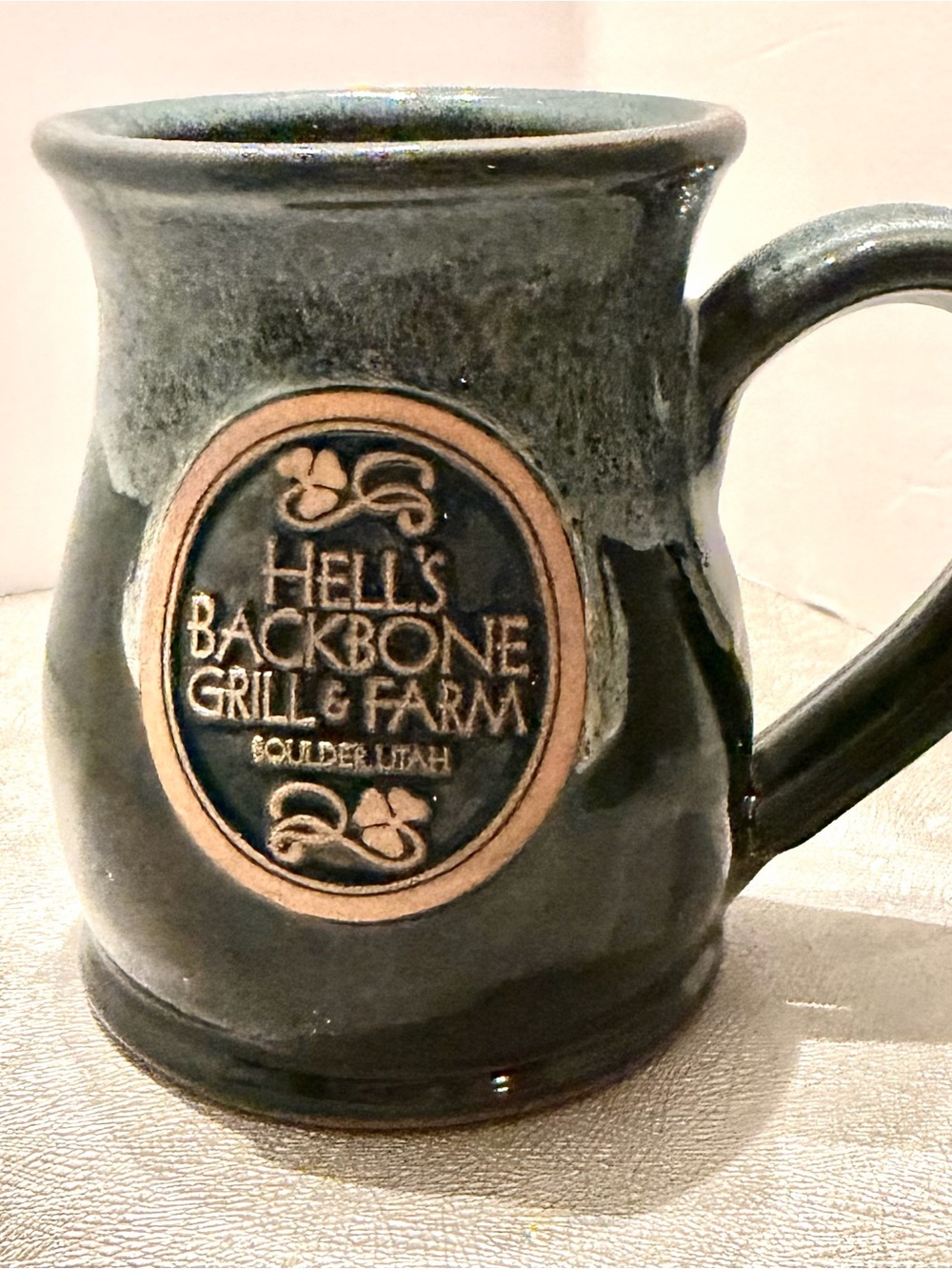 Hell’s Backbone Grill & Farm Deneen Pottery Bolder Utha Dark Green Ceramic Mug.